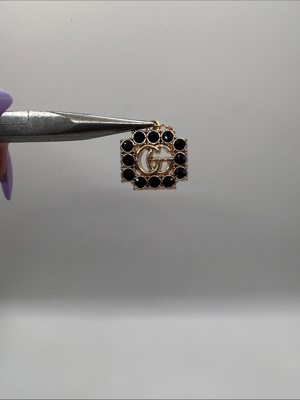 1430. Gold and Black Crystal Logo Charm Pendant
